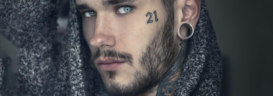 30 Cool Face Tattoos for Men  Meaning  The Trend Spotter