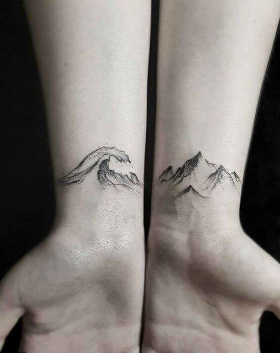 Small Mountain and wave tattoo on wrist