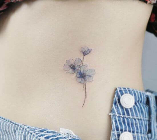 Beautiful Small Flower Tattoo Designs on Women's Rib