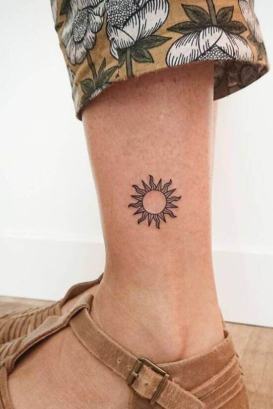 Sun tattoo designs on girl leg