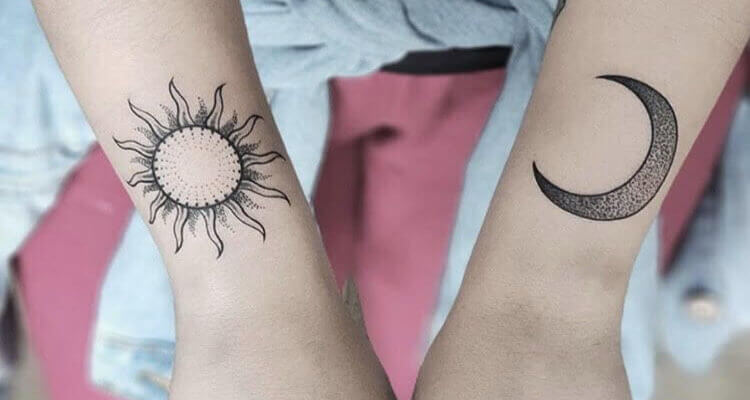 Black Tiny Tribal Sun Tattoo On Girl Left Shoulder