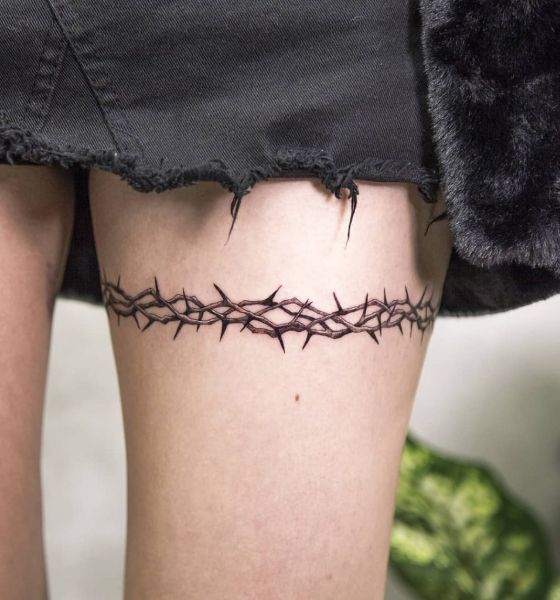 Thorn Wrap Tattoo on Thigh