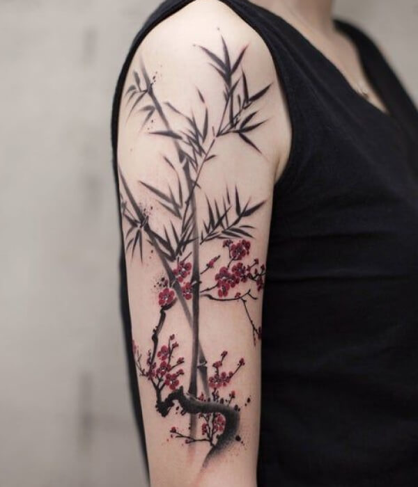 Bamboo tattoo with flowers