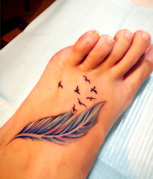 Colored Flying Bird Foot Tattoo