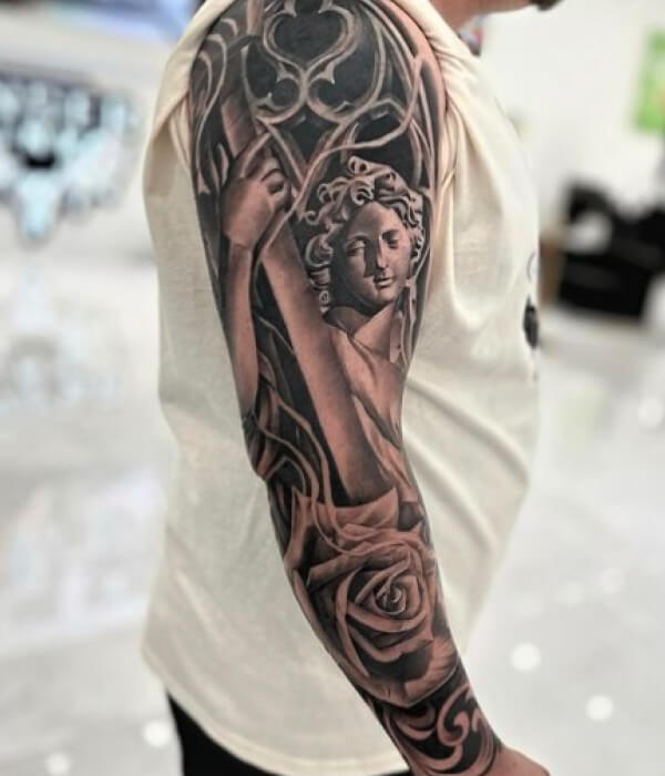 Music-Inspired-Full-Arm-Tattoo-For-Men