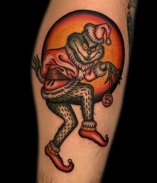 Grinch-With-a-Snow-Globe-Tattoo