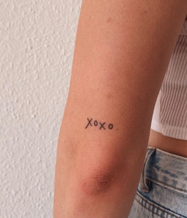 XO Tattoo on elbow