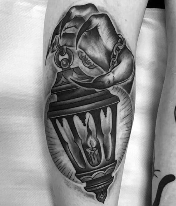 Hand-holding Glowing Candle Lantern Tattoo