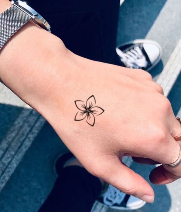 Plumeria-Hand-Tattoo